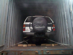 SUV loaded into container
